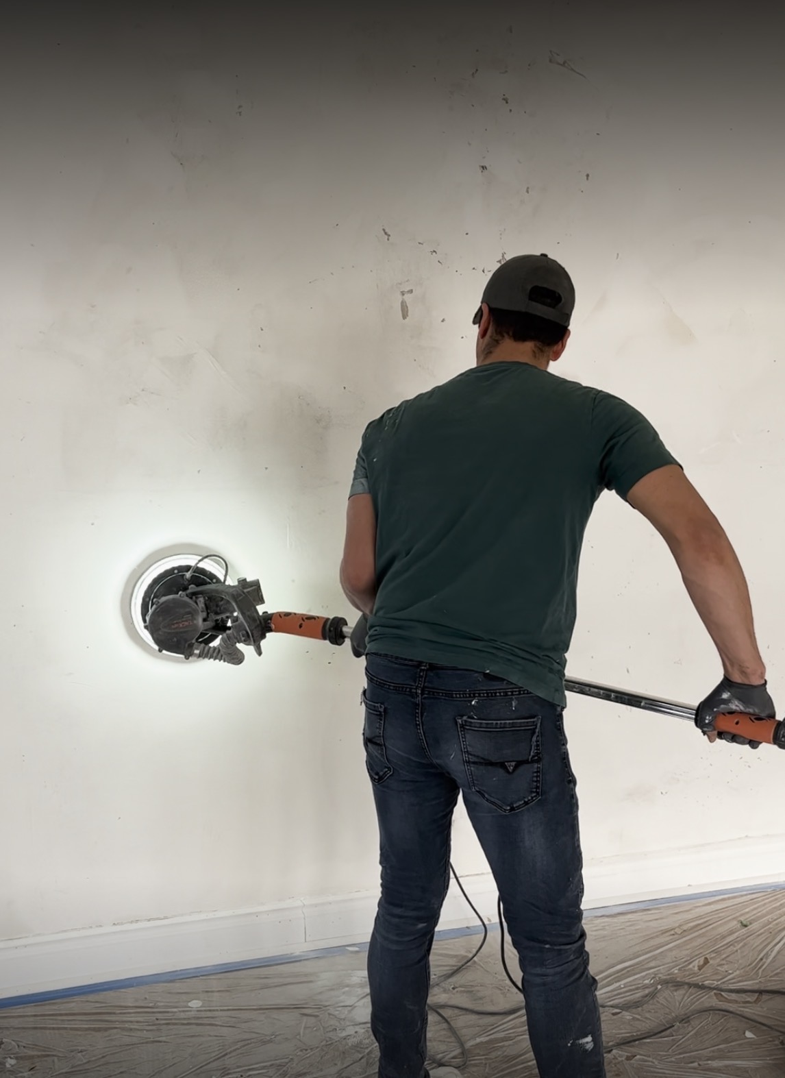Technician working on the condo wall